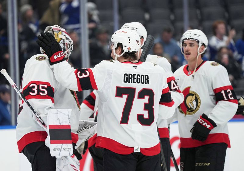 Nov 12, 2024; Toronto, Ontario, CAN; Ottawa Senators left wing Noah Gregor (73) celebrates a win with goaltender Linus Ullmark (35) against the Toronto Maple Leafs at Scotiabank Arena. Mandatory Credit: Nick Turchiaro-Imagn Images