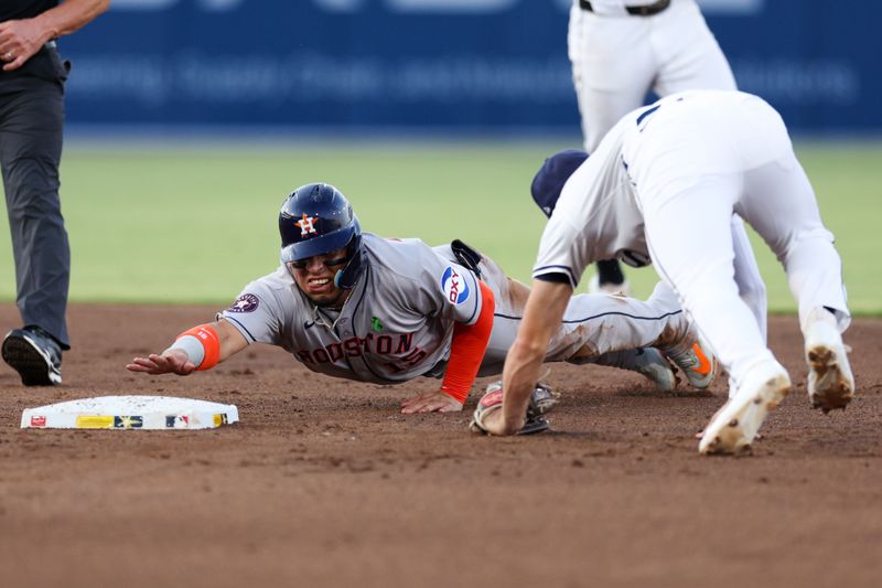 May 19, 2025; Tampa, Florida, USA; Houston Astros third baseman Isaac Paredes (15) is caught stealing by Tampa Bay Rays second baseman Brandon Lowe (8) in the third inning at George M. Steinbrenner Field. Mandatory Credit: Nathan Ray Seebeck-Imagn Images