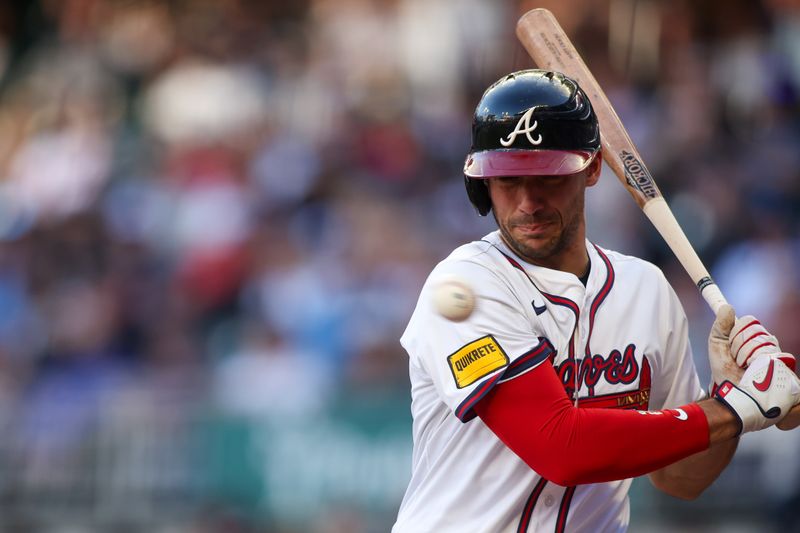 May 5, 2025; Atlanta, Georgia, USA; Atlanta Braves first baseman Matt Olson (28) gets out of the way of a pitch against the Cincinnati Reds in the first inning at Truist Park. Mandatory Credit: Brett Davis-Imagn Images