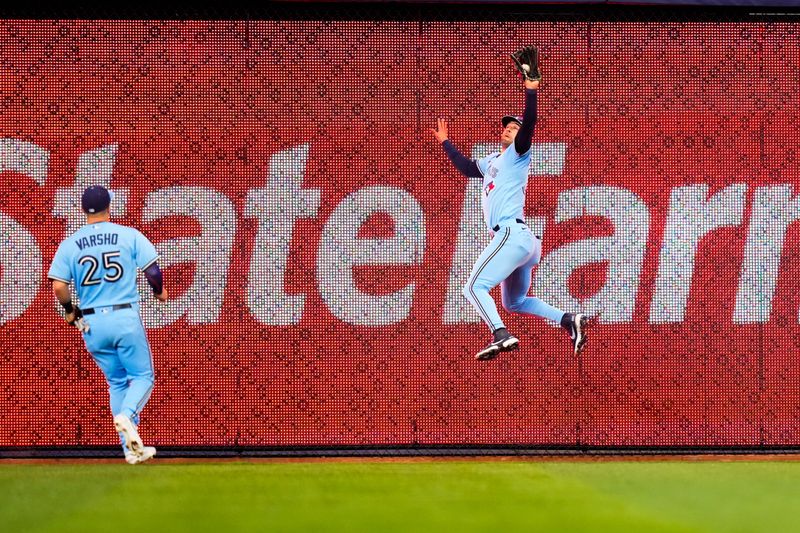 Jun 20, 2023; Miami, Florida, USA; Toronto Blue Jays center fielder Kevin Kiermaier (39) catches a fly ball against the Miami Marlins during the fourth inning at loanDepot Park. Mandatory Credit: Rich Storry-USA TODAY Sports