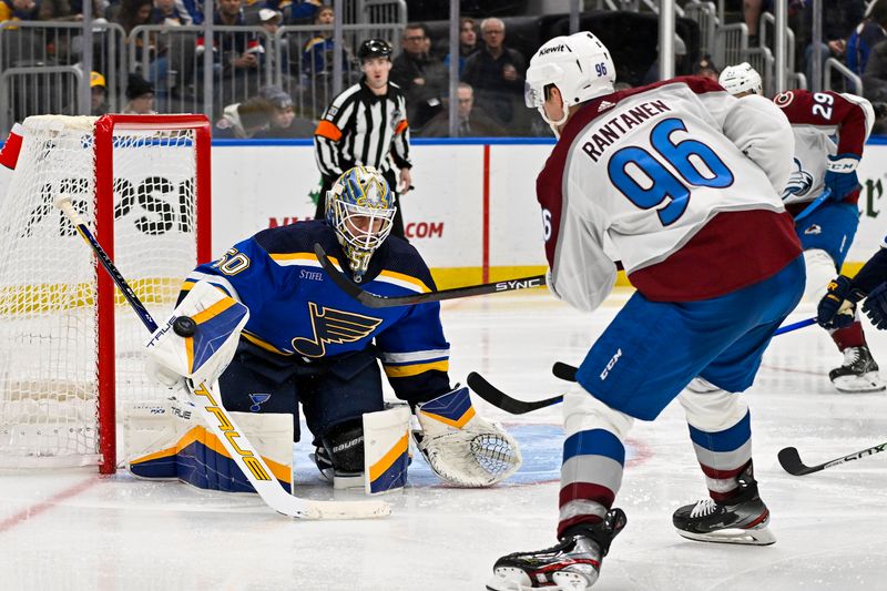 Dec 29, 2023; St. Louis, Missouri, USA;  St. Louis Blues goaltender Jordan Binnington (50) makes a save against Colorado Avalanche right wing Mikko Rantanen (96) during the third period at Enterprise Center. Mandatory Credit: Jeff Curry-USA TODAY Sports