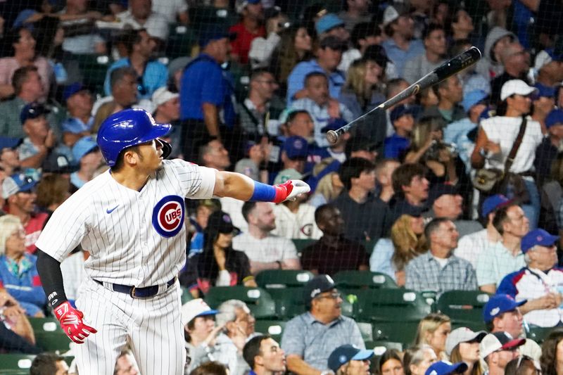 Jul 18, 2023; Chicago, Illinois, USA; Chicago Cubs right fielder Seiya Suzuki (27) hits a home run against the Washington Nationals during the sixth inning at Wrigley Field. Mandatory Credit: David Banks-USA TODAY Sports