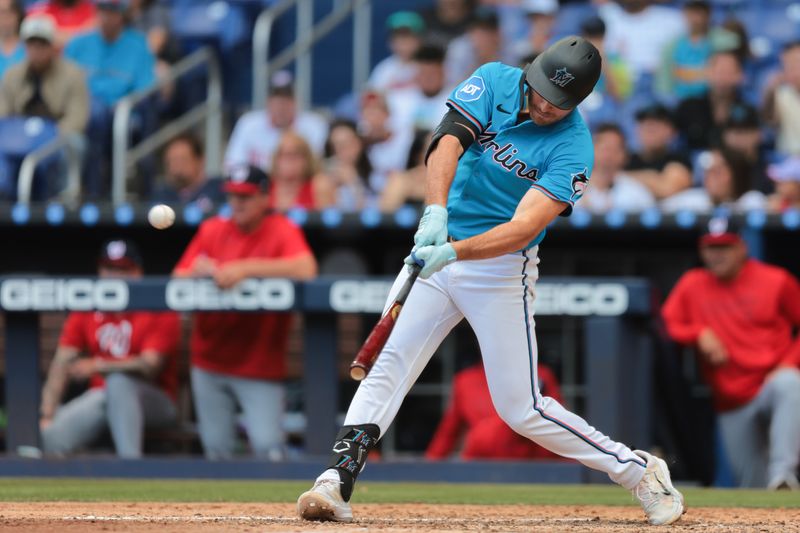 Apr 13, 2025; Miami, Florida, USA; Miami Marlins pinch hitter Matt Mervis (36) hits a three-run home run against the Washington Nationals during the seventh inning at loanDepot Park. Mandatory Credit: Sam Navarro-Imagn Images
