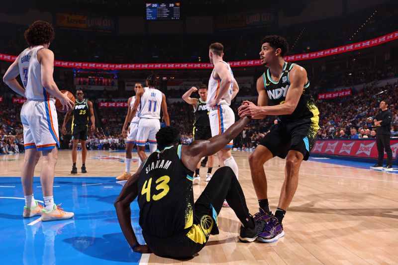 OKLAHOMA CITY, OK - MARCH 12: Ben Sheppard #26 of the Indiana Pacers helps up Pascal Siakam #43 during the game against the Oklahoma City Thunder on March 12, 2024 at Paycom Arena in Oklahoma City, Oklahoma. NOTE TO USER: User expressly acknowledges and agrees that, by downloading and or using this photograph, User is consenting to the terms and conditions of the Getty Images License Agreement. Mandatory Copyright Notice: Copyright 2024 NBAE (Photo by Zach Beeker/NBAE via Getty Images)