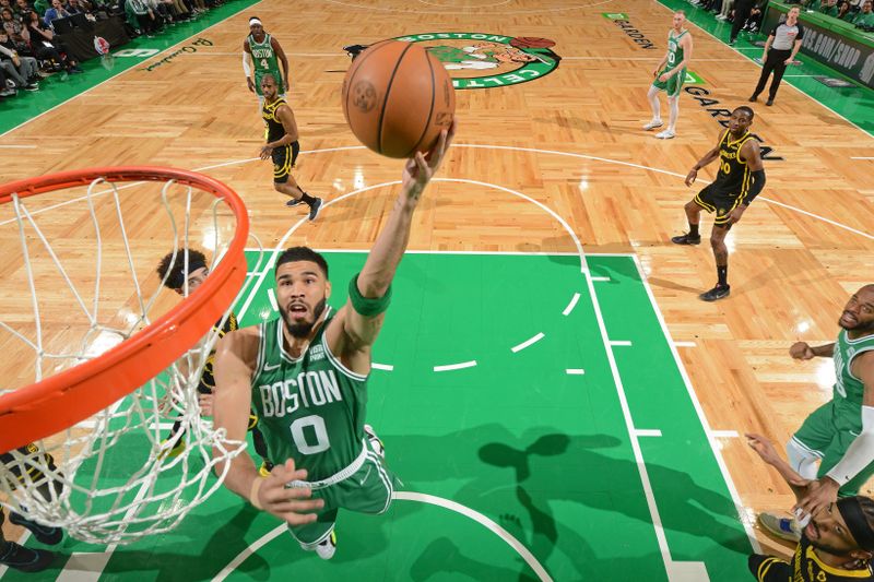 BOSTON, MA - MARCH 3: Jayson Tatum #0 of the Boston Celtics drives to the basket during the game against the Golden State Warriors on March 3, 2024 at the TD Garden in Boston, Massachusetts. NOTE TO USER: User expressly acknowledges and agrees that, by downloading and or using this photograph, User is consenting to the terms and conditions of the Getty Images License Agreement. Mandatory Copyright Notice: Copyright 2024 NBAE  (Photo by Brian Babineau/NBAE via Getty Images)