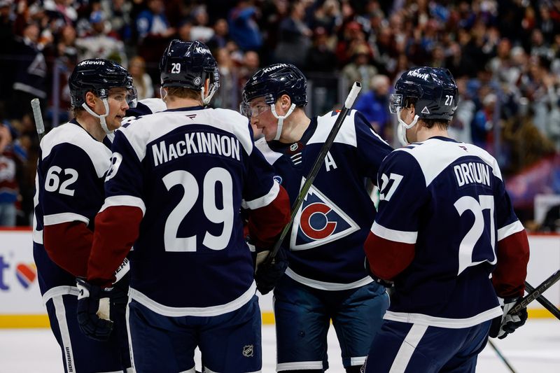 Jan 18, 2025; Denver, Colorado, USA; Colorado Avalanche defenseman Cale Makar (8) celebrates his goal with left wing Artturi Lehkonen (62) and center Nathan MacKinnon (29) and left wing Jonathan Drouin (27) in the second period against the Dallas Stars at Ball Arena. Mandatory Credit: Isaiah J. Downing-Imagn Images