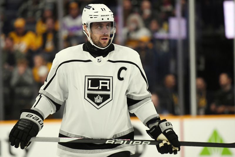 Jan 31, 2024; Nashville, Tennessee, USA; Los Angeles Kings center Anze Kopitar (11) skates in for a face off during the third period against the Nashville Predators at Bridgestone Arena. Mandatory Credit: Christopher Hanewinckel-USA TODAY Sports