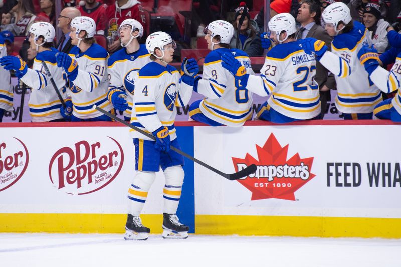 Dec 23, 2025; Ottawa, Ontario, CAN; Buffalo Sabres defenseman Bowen Byram (4) celebrates with teammates after scoring a goal in the first period against the Ottawa Senators at the Canadian Tire Centre. Mandatory Credit: Marc DesRosiers-IMAGN Images