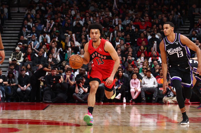 TORONTO, CANADA - MARCH 20: Jordan Nwora #13 of the Toronto Raptors dribbles the ball during the game against the Sacramento Kings on March 20, 2024 at the Scotiabank Arena in Toronto, Ontario, Canada.  NOTE TO USER: User expressly acknowledges and agrees that, by downloading and or using this Photograph, user is consenting to the terms and conditions of the Getty Images License Agreement.  Mandatory Copyright Notice: Copyright 2024 NBAE (Photo by Vaughn Ridley/NBAE via Getty Images)