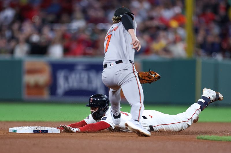 Sep 10, 2024; Boston, Massachusetts, USA; Boston Red Sox catcher Connor Wong (12) slides into second during the fourth inning against the Baltimore Orioles at Fenway Park. Mandatory Credit: Paul Rutherford-Imagn Images