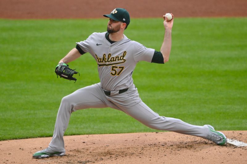 Apr 20, 2024; Cleveland, Ohio, USA; Oakland Athletics starting pitcher Alex Wood (57) delivers a pitch in the first inning against the Cleveland Guardians at Progressive Field. Mandatory Credit: David Richard-USA TODAY Sports