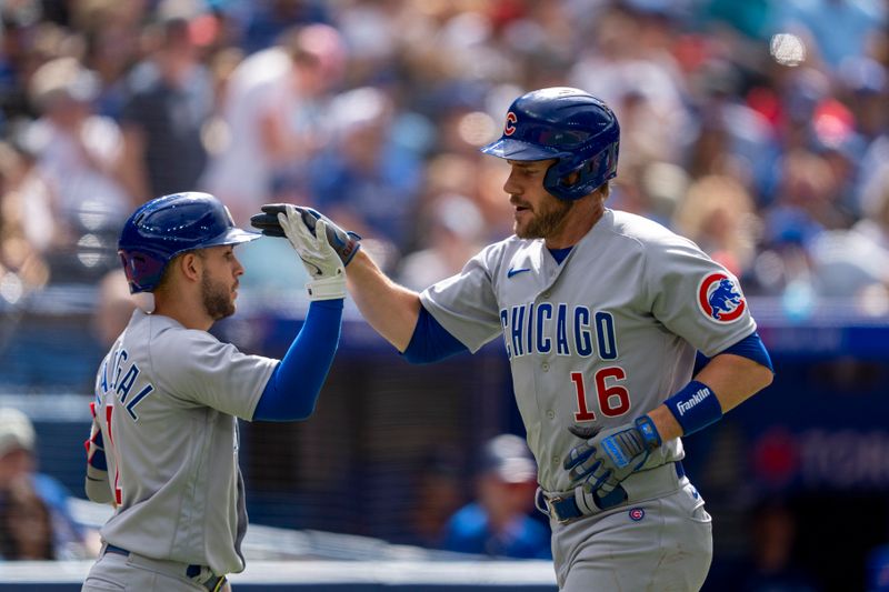 Aug 13, 2023; Toronto, Ontario, CAN; Chicago Cubs third baseman Patrick Wisdom (16) celebrates after hitting a home run against the Toronto Blue Jays during the seventh inning at Rogers Centre. Mandatory Credit: Kevin Sousa-USA TODAY Sports