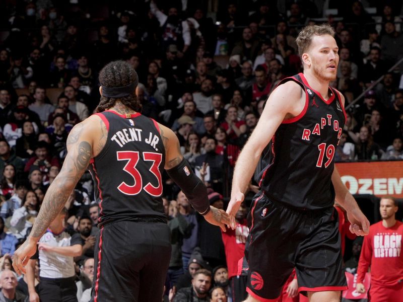 TORONTO, CANADA - FEBRUARY 23: Jakob Poeltl #19 high fives Gary Trent Jr. #33 of the Toronto Raptors during the game against the New Orleans Pelicans on February 23, 2023 at the Scotiabank Arena in Toronto, Ontario, Canada.  NOTE TO USER: User expressly acknowledges and agrees that, by downloading and or using this Photograph, user is consenting to the terms and conditions of the Getty Images License Agreement.  Mandatory Copyright Notice: Copyright 2023 NBAE (Photo by Mark Blinch/NBAE via Getty Images)