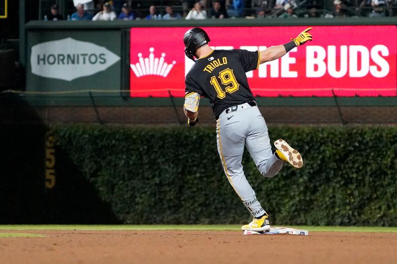 Sep 3, 2024; Chicago, Illinois, USA; Pittsburgh Pirates third baseman Jared Triolo (19) runs the bases after hitting a three-run home run against the Chicago Cubs during the seventh inning at Wrigley Field. Mandatory Credit: David Banks-Imagn Images