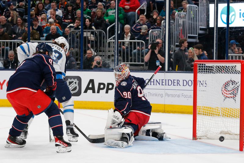 Mar 17, 2024; Columbus, Ohio, USA; Winnipeg Jets right wing Tyler Toffoli (73) shot attempt slides wide of the goal against the Columbus Blue Jackets during the first period at Nationwide Arena. Mandatory Credit: Russell LaBounty-USA TODAY Sports