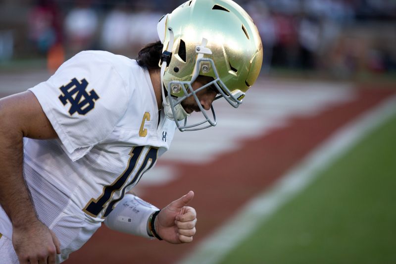 Nov 25, 2023; Stanford, California, USA; Notre Dame Fighting Irish quarterback Sam Hartman (10) gets ready to take the field against the Stanford Cardinal during the first quarter at Stanford Stadium. Mandatory Credit: D. Ross Cameron-USA TODAY Sports