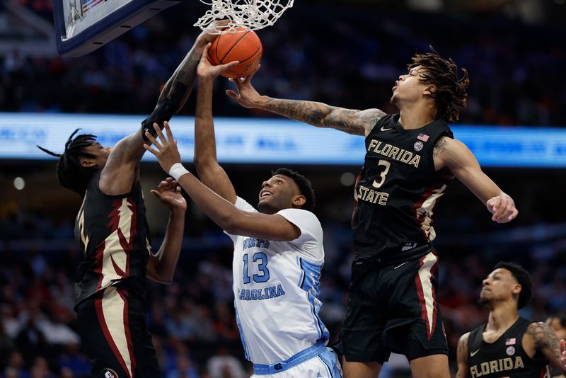 Mar 14, 2024; Washington, D.C., USA; North Carolina forward Jalen Washington (13) has a shot blocked by Florida State forward Jamir Watkins (2) in the second half at Capital One Arena. Mandatory Credit: Geoff Burke-USA TODAY Sports