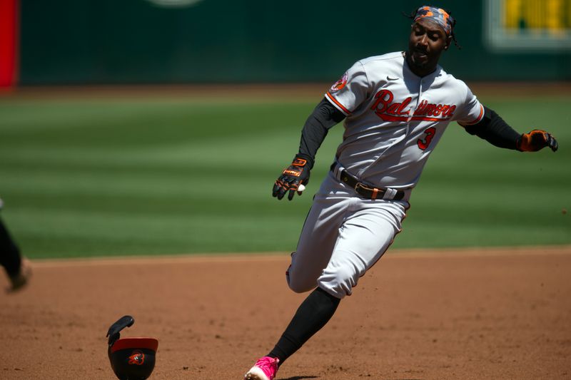 Aug 20, 2023; Oakland, California, USA; Baltimore Orioles shortstop Jorge Mateo (3) rounds third and heads for home on his inside-the-park home run against the Oakland Athletics during the second inning at Oakland-Alameda County Coliseum. Mandatory Credit: D. Ross Cameron-USA TODAY Sports