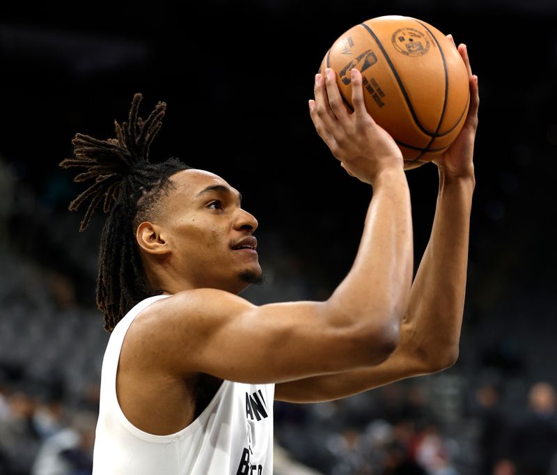 SAN ANTONIO, TX - NOVEMBER 22: Devin Vassell #24 of the San Antonio Spurs takes warm up shots before their game against the Los Angeles Clippers at Frost Bank Center on November 22, 2023 in San Antonio, Texas. NOTE TO USER: User expressly acknowledges and agrees that, by downloading and or using this photograph, User is consenting to terms and conditions of the Getty Images License Agreement. (Photo by Ronald Cortes/Getty Images)