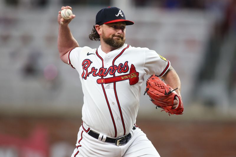 Aug 16, 2023; Atlanta, Georgia, USA; Atlanta Braves relief pitcher Kirby Yates (22) throws against the New York Yankees in the eighth inning at Truist Park. Mandatory Credit: Brett Davis-USA TODAY Sports
