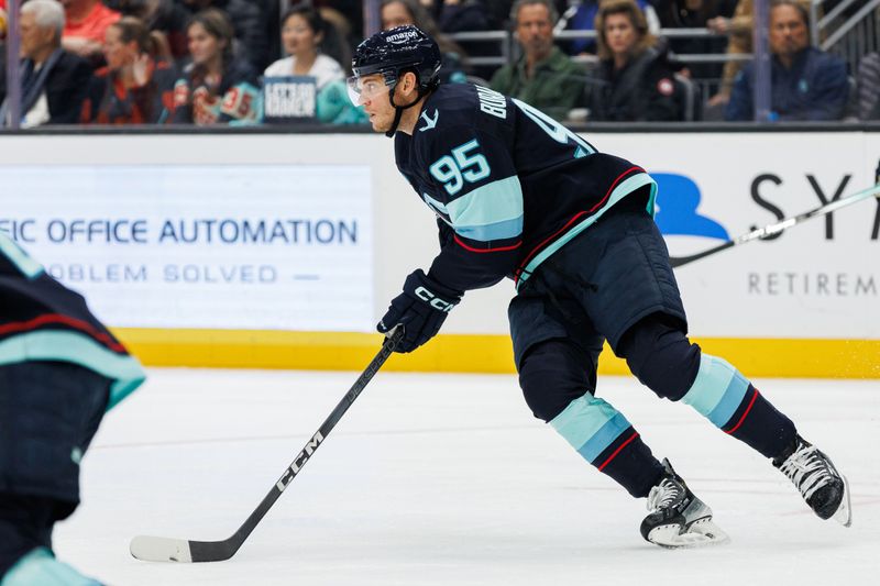 Oct 19, 2024; Seattle, Washington, USA; Seattle Kraken left wing Andre Burakovsky (95) skates with the puck against the Calgary Flames during the second period at Climate Pledge Arena. Mandatory Credit: Caean Couto-Imagn Images