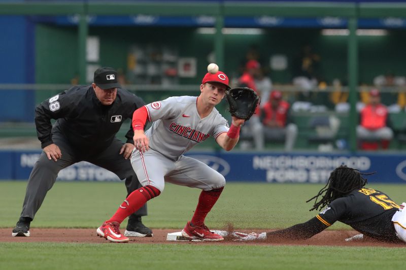 May 20, 2025; Pittsburgh, Pennsylvania, USA; Pittsburgh Pirates center fielder Oneil Cruz (15) steals second base as Cincinnati Reds second baseman Matt McLain (9) takes a late throw during the first inning at PNC Park. Mandatory Credit: Charles LeClaire-Imagn Images