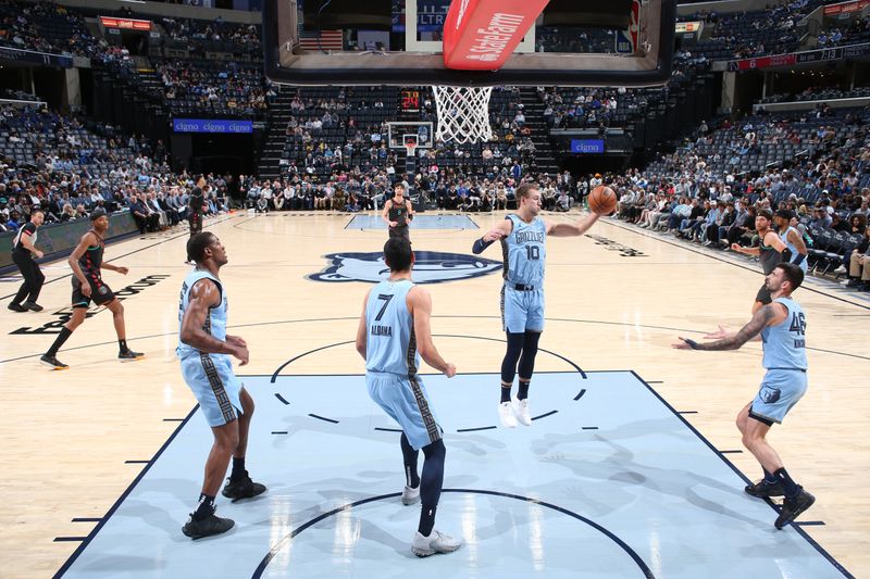 MEMPHIS, TN - MARCH 12: Luke Kennard #10 of the Memphis Grizzlies grabs a rebound during the game against the Washington Wizards on March 12, 2024 at FedExForum in Memphis, Tennessee. NOTE TO USER: User expressly acknowledges and agrees that, by downloading and or using this photograph, User is consenting to the terms and conditions of the Getty Images License Agreement. Mandatory Copyright Notice: Copyright 2024 NBAE (Photo by Joe Murphy/NBAE via Getty Images)