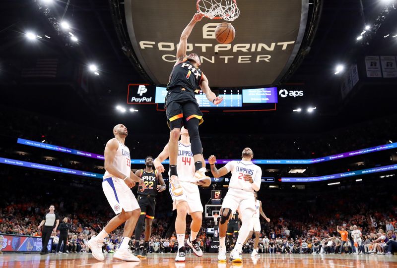 PHOENIX, ARIZONA - APRIL 25: Devin Booker #1 of the Phoenix Suns dunks the ball during the third quarter against the LA Clippers in game five of the Western Conference First Round Playoffs at Footprint Center on April 25, 2023 in Phoenix, Arizona. NOTE TO USER: User expressly acknowledges and agrees that, by downloading and or using this photograph, User is consenting to the terms and conditions of the Getty Images License Agreement. (Photo by Christian Petersen/Getty Images)