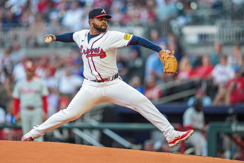 Aug 20, 2024; Cumberland, Georgia, USA; Atlanta Braves starting pitcher Reynaldo Lopez (40) pitches against the Philadelphia Phillies during the second inning at Truist Park. Mandatory Credit: Dale Zanine-USA TODAY Sports