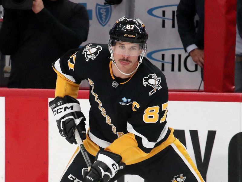 Nov 19, 2024; Pittsburgh, Pennsylvania, USA;  Pittsburgh Penguins center Sidney Crosby (87) handles the puck against the Tampa Bay Lightning during the third period at PPG Paints Arena. Mandatory Credit: Charles LeClaire-Imagn Images