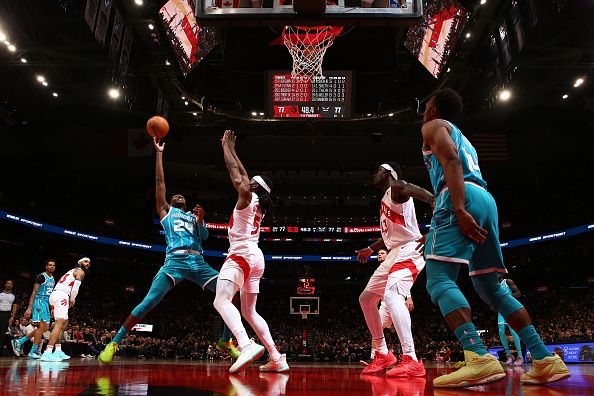 TORONTO, CANADA - DECEMBER 18:  Brandon Miller #24 of the Charlotte Hornets drives to the basket during the game against the Toronto Raptors on December 18, 2023 at the Scotiabank Arena in Toronto, Ontario, Canada.  NOTE TO USER: User expressly acknowledges and agrees that, by downloading and or using this Photograph, user is consenting to the terms and conditions of the Getty Images License Agreement.  Mandatory Copyright Notice: Copyright 2023 NBAE (Photo by Vaughn Ridley/NBAE via Getty Images)