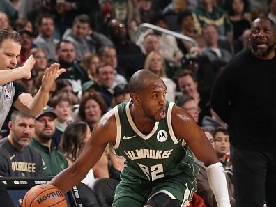 MILWAUKEE, WI - DECEMBER 21:  Khris Middleton #22 of the Milwaukee Bucks handles the ball during the game against the Orlando Magic on December 21, 2023 at the Fiserv Forum Center in Milwaukee, Wisconsin. NOTE TO USER: User expressly acknowledges and agrees that, by downloading and or using this Photograph, user is consenting to the terms and conditions of the Getty Images License Agreement. Mandatory Copyright Notice: Copyright 2023 NBAE (Photo by Gary Dineen/NBAE via Getty Images).