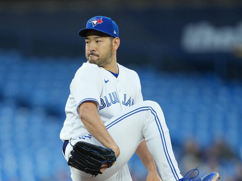 Sep 13, 2023; Toronto, Ontario, CAN; Toronto Blue Jays starting pitcher Yusei Kikuchi (16) throws a pitch against the Texas Rangers during the first inning at Rogers Centre. Mandatory Credit: Nick Turchiaro-USA TODAY Sports