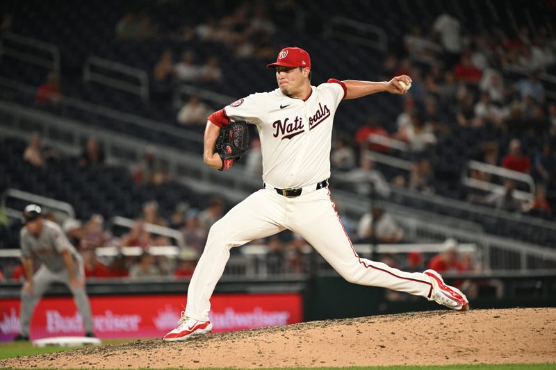 Aug 6, 2024; Washington, District of Columbia, USA; Washington Nationals relief pitcher Robert Garcia (61) throws a pitch against the San Francisco Giants during the seventh inning at Nationals Park. Mandatory Credit: Rafael Suanes-USA TODAY Sports