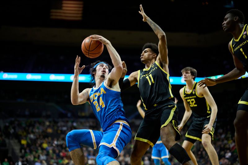 Feb 11, 2023; Eugene, Oregon, USA;  UCLA Bruins guard Jaime Jaquez Jr. (24) makes a move to the basket during the second half against Oregon Ducks guard Rivaldo Soares (11) at Matthew Knight Arena. Mandatory Credit: Troy Wayrynen-USA TODAY Sports