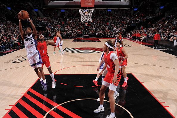 PORTLAND, OR - DECEMBER 26: De'Aaron Fox #5 of the Sacramento Kings grabs a rebound during the game against the Portland Trail Blazers on December 26, 2023 at the Moda Center Arena in Portland, Oregon. NOTE TO USER: User expressly acknowledges and agrees that, by downloading and or using this photograph, user is consenting to the terms and conditions of the Getty Images License Agreement. Mandatory Copyright Notice: Copyright 2023 NBAE (Photo by Cameron Browne/NBAE via Getty Images)