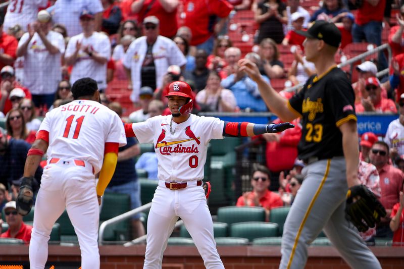 May 7, 2025; St. Louis, Missouri, USA;  St. Louis Cardinals shortstop Masyn Winn (0) reacts after center fielder Victor Scott II (11) scored against the Pittsburgh Pirates during the third inning at Busch Stadium. Mandatory Credit: Jeff Curry-Imagn Images