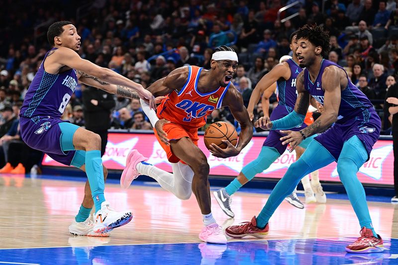 OKLAHOMA CITY, OKLAHOMA - FEBRUARY 2: Shai Gilgeous-Alexander #2 of the Oklahoma City Thunder drives the lane between Nick Smith Jr. #8 and Leaky Black #12 of the Charlotte Hornets during the second half at Paycom Center on February 2, 2024 in Oklahoma City, Oklahoma. NOTE TO USER: User expressly acknowledges and agrees that, by downloading and or using this Photograph, user is consenting to the terms and conditions of the Getty Images License Agreement. (Photo by Joshua Gateley/Getty Images)