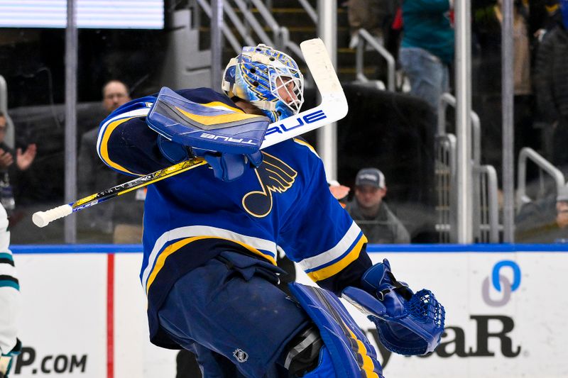 Nov 21, 2024; St. Louis, Missouri, USA;  St. Louis Blues goaltender Jordan Binnington (50) reacts after saving a shot by San Jose Sharks left wing William Eklund (not pictured) giving the Blues a win in shootouts at Enterprise Center. Mandatory Credit: Jeff Curry-Imagn Images