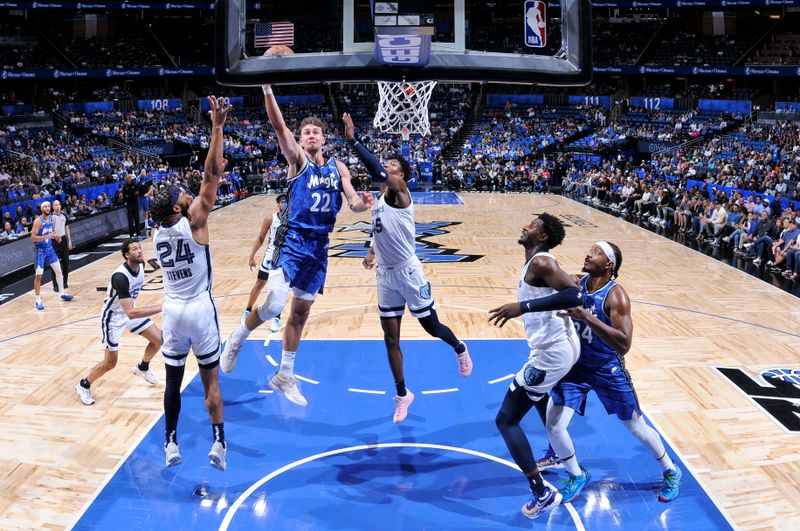 ORLANDO, FL - MARCH 30: Franz Wagner #22 of the Orlando Magic drives to the basket during the game against the Memphis Grizzlies on March 30, 2024 at the Kia Center in Orlando, Florida. NOTE TO USER: User expressly acknowledges and agrees that, by downloading and or using this photograph, User is consenting to the terms and conditions of the Getty Images License Agreement. Mandatory Copyright Notice: Copyright 2024 NBAE (Photo by Fernando Medina/NBAE via Getty Images)