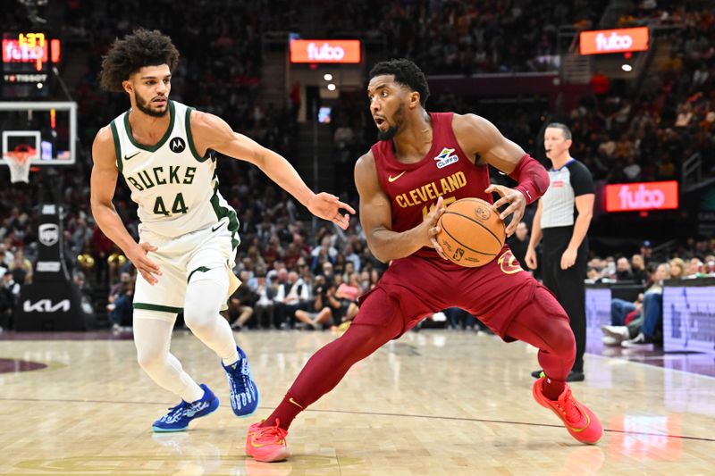 CLEVELAND, OHIO - NOVEMBER 04: Andre Jackson Jr. #44 of the Milwaukee Bucks guards Donovan Mitchell #45 of the Cleveland Cavaliers during the third quarter at Rocket Mortgage Fieldhouse on November 04, 2024 in Cleveland, Ohio. The Cavaliers defeated the Bucks 116-114. NOTE TO USER: User expressly acknowledges and agrees that, by downloading and or using this photograph, User is consenting to the terms and conditions of the Getty Images License Agreement. (Photo by Jason Miller/Getty Images)