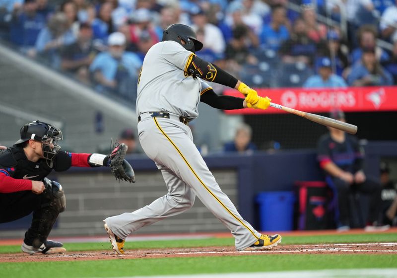 May 31, 2024; Toronto, Ontario, CAN; Pittsburgh Pirates first baseman Rowdy Tellez (44) hits a single against the Toronto Blue Jays during the fifth inning at Rogers Centre. Mandatory Credit: Nick Turchiaro-USA TODAY Sports