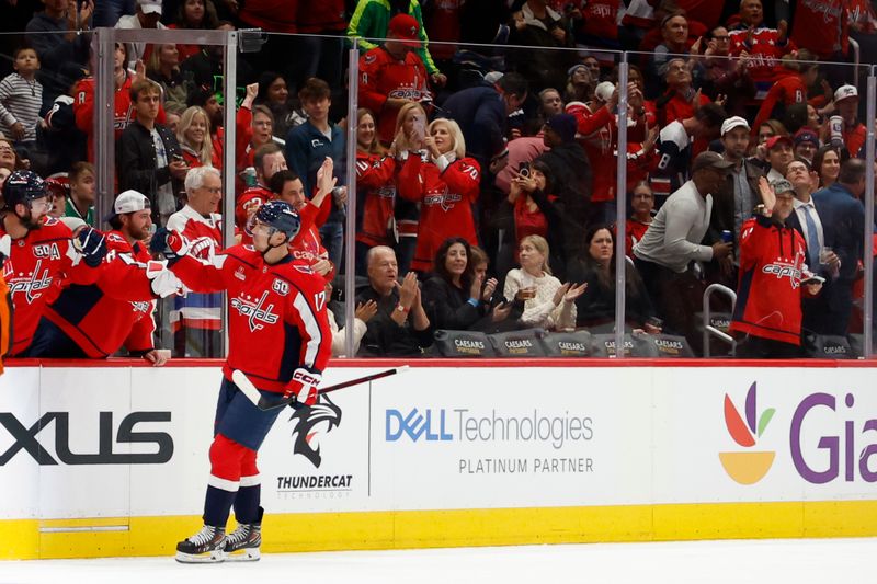 Oct 17, 2024; Washington, District of Columbia, USA; /17/ celebrates with teammates after scoring a goal against the Dallas Stars in the second period at Capital One Arena. Mandatory Credit: Geoff Burke-Imagn Images