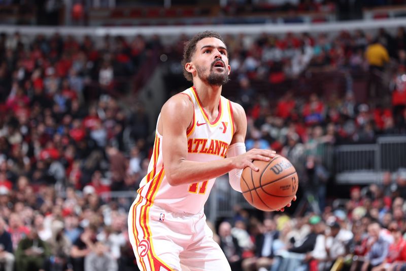 CHICAGO, IL - APRIL 17:  Trae Young #11 of the Atlanta Hawks shoots a free throw during the game against the Chicago Bulls during the 2024 Play-In Tournament  on April 17, 2024 at United Center in Chicago, Illinois. NOTE TO USER: User expressly acknowledges and agrees that, by downloading and or using this photograph, User is consenting to the terms and conditions of the Getty Images License Agreement. Mandatory Copyright Notice: Copyright 2024 NBAE (Photo by Jeff Haynes/NBAE via Getty Images)