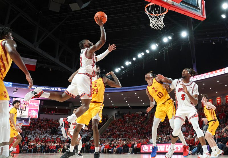 Feb 19, 2024; Houston, Texas, USA; Houston Cougars guard Jamal Shead (1) attempts to score a basket during the second half against the Iowa State Cyclones at Fertitta Center. Mandatory Credit: Troy Taormina-USA TODAY Sports