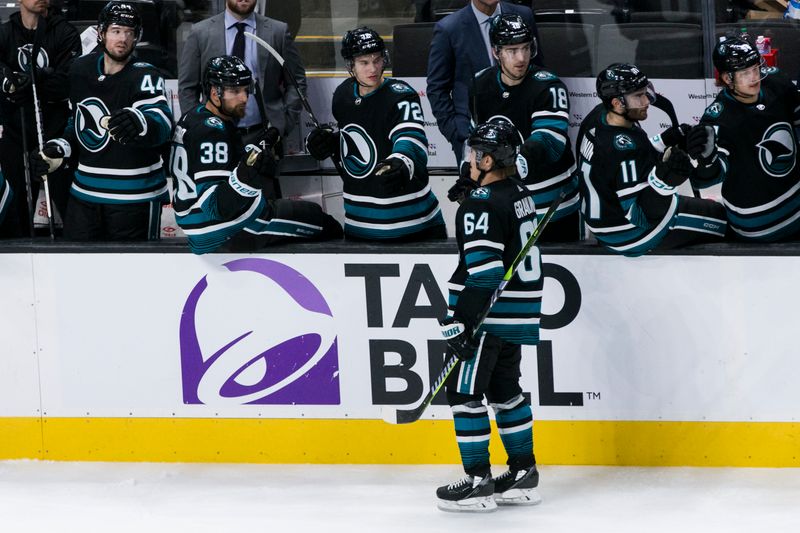 Mar 5, 2024; San Jose, California, USA; San Jose Sharks center Mikael Granlund (64) is congratulated by teammates after he scored against the Dallas Stars during the third period at SAP Center at San Jose. Mandatory Credit: John Hefti-USA TODAY Sports