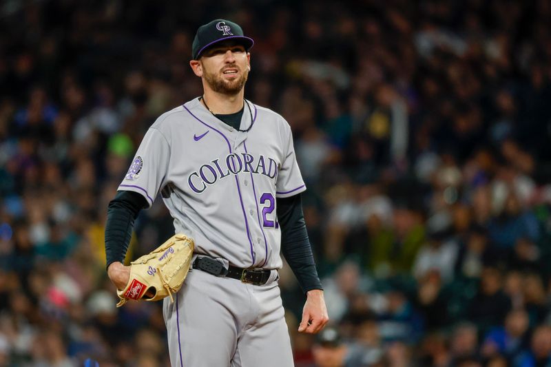 Apr 14, 2023; Seattle, Washington, USA; Colorado Rockies starting pitcher Austin Gomber (26) stands on the mound moments before being relieved for during the fourth inning against the Seattle Mariners at T-Mobile Park. Mandatory Credit: Joe Nicholson-USA TODAY Sports