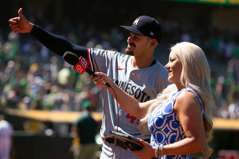 Jun 23, 2024; Oakland, California, USA; Minnesota Twins starting pitcher Pablo López (49) talks with a television commentator after securing a 3-0 victory over the Oakland Athletics at Oakland-Alameda County Coliseum. Mandatory Credit: D. Ross Cameron-USA TODAY Sports