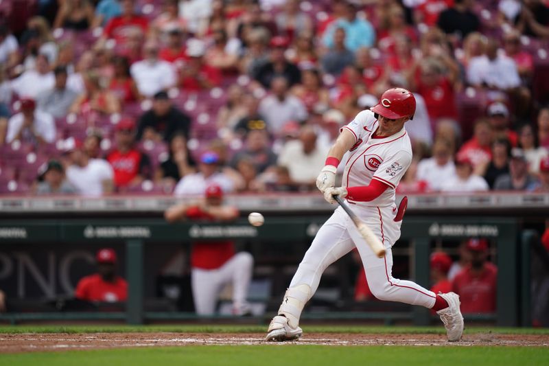 Aug 29, 2024; Cincinnati, Ohio, USA;  Cincinnati Reds center fielder TJ Friedl (29) hits the ball during the fourth inning of the MLB game between the Cincinnati Reds and Oakland Athletics, Thursday, Aug. 29, 2024, at Cintas Center in Cincinnati. Mandatory Credit: Frank Bowen IV/The Cincinnati Enquirer-USA TODAY Sports