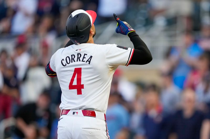 May 8, 2024; Minneapolis, Minnesota, USA; Minnesota Twins shortstop Carlos Correa (4) celebrates after hitting a solo home run against the Seattle Mariners in the first inning at Target Field. Mandatory Credit: Jesse Johnson-USA TODAY Sports